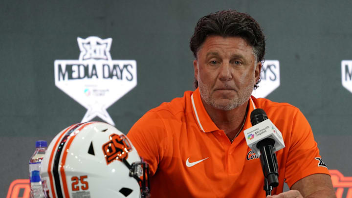 Jul 9, 2025; Frisco, TX, USA; Oklahoma State head coach Mike Gundy speaks with the media during 2025 Big 12 Football Media Days at The Star. Mandatory Credit: Raymond Carlin III-Imagn Images Jul 9, 2025; Frisco, TX, USA; Oklahoma State head coach Mike Gundy speaks with the media during 2025 Big 12 Football Media Days at The Star. Mandatory Credit: Raymond Carlin III-Imagn Images