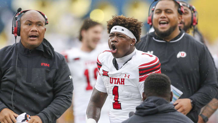 Utah Utes running back Wayshawn Parker (1) celebrates after his touchdown catch was ruled a catch during the third quarter against the West Virginia Mountaineers at Milan Puskar Stadium.