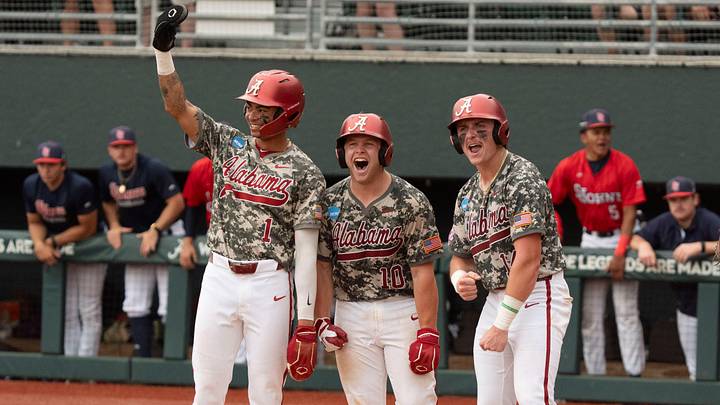 Jun 7, 2026; Tuscaloosa, AL, USA; Alabama players Justin Lebron (1), Brady Neal (10) and Peyton Steele (14) wait to welcome Alabama batter Jason Torres (32) to home plate after Torres clouted a grand slam in Game 2 of the Super Regional between Alabama and St. John's at Sewell-Thomas Stadium. Jun 7, 2026; Tuscaloosa, AL, USA; Alabama players Justin Lebron (1), Brady Neal (10) and Peyton Steele (14) wait to welcome Alabama batter Jason Torres (32) to home plate after Torres clouted a grand slam in Game 2 of the Super Regional between Alabama and St. John's at Sewell-Thomas Stadium.