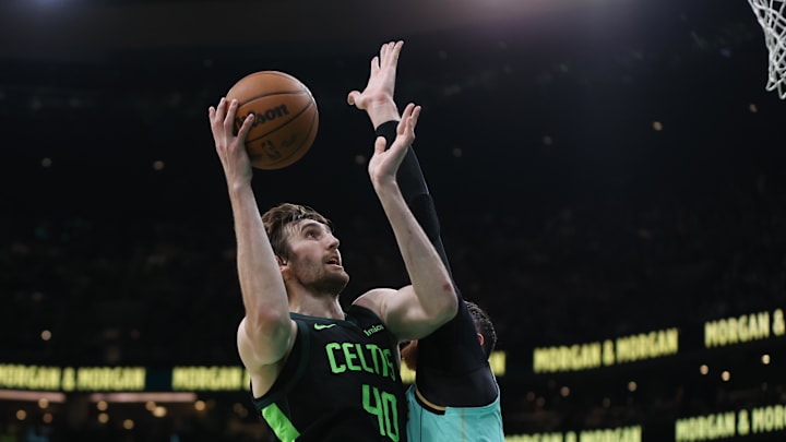 Apr 13, 2025; Boston, Massachusetts, USA; Boston Celtics center Luke Kornet (40) shoots during the first half against the Charlotte Hornets at TD Garden. Mandatory Credit: Paul Rutherford-Imagn Images