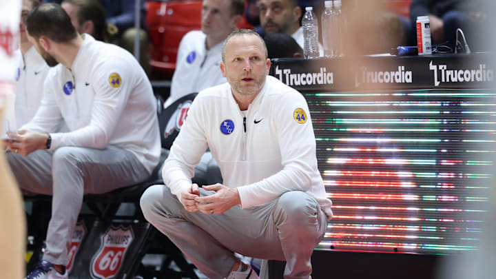 Mar 4, 2025; Salt Lake City, Utah, USA; West Virginia Mountaineers head coach Darian DeVries looks on against the Utah Utes during the second half at Jon M. Huntsman Center. Mandatory Credit: Rob Gray-Imagn Images