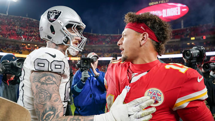 Nov 29, 2024; Kansas City, Missouri, USA; Kansas City Chiefs quarterback Patrick Mahomes (15) greets Las Vegas Raiders defensive end Maxx Crosby (98) after the game at GEHA Field at Arrowhead Stadium. Mandatory Credit: Denny Medley-Imagn Images