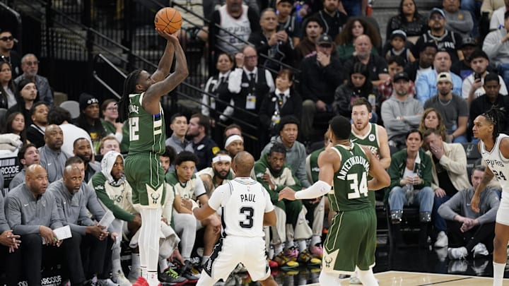 Jan 31, 2025; San Antonio, Texas, USA; Milwaukee Bucks guard Taurean Prince (12) shoots over San Antonio Spurs guard Chris Paul (3) during the first half at Frost Bank Center. Mandatory Credit: Scott Wachter-Imagn Images