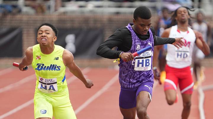 Bullis School star Quincy Wilson (left) edges Kingston College's Jason Pitter at the finish line during the 4x400-meter relay Championship of America on the final day of the Penn Relays at Franklin Field in Philadelphia on April 25, 2026.