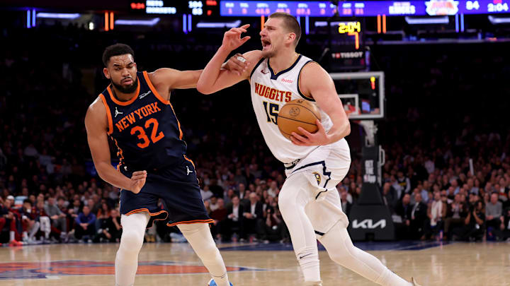 Jan 29, 2025; New York, New York, USA; Denver Nuggets center Nikola Jokic (15) is fouled by New York Knicks center Karl-Anthony Towns (32) as he drives to the basket during the third quarter at Madison Square Garden. Mandatory Credit: Brad Penner-Imagn Images