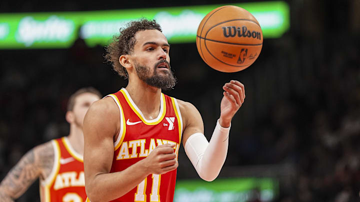 Jan 22, 2025; Atlanta, Georgia, USA; Atlanta Hawks guard Trae Young (11) prepares to shoot from the free throw line against the Detroit Pistons during the second half at State Farm Arena. Mandatory Credit: Dale Zanine-Imagn Images