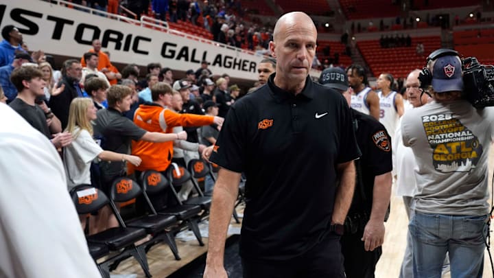 Oklahoma State coach Steve Lutz walks to the fans after a men's college basketball game between the Oklahoma State Cowboys and the Kansas Jayhawks at Gallagher-Iba Arena in Stillwater, Okla., Wednesday, Feb. 18, 2026.