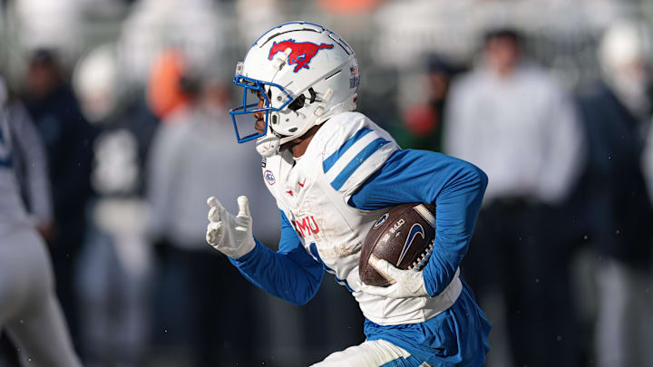 Dec 21, 2024; University Park, Pennsylvania, USA; Southern Methodist Mustangs running back Brashard Smith (1) carries the ball during the second half against the Penn State Nittany Lions at Beaver Stadium. Mandatory Credit: Vincent Carchietta-Imagn Images