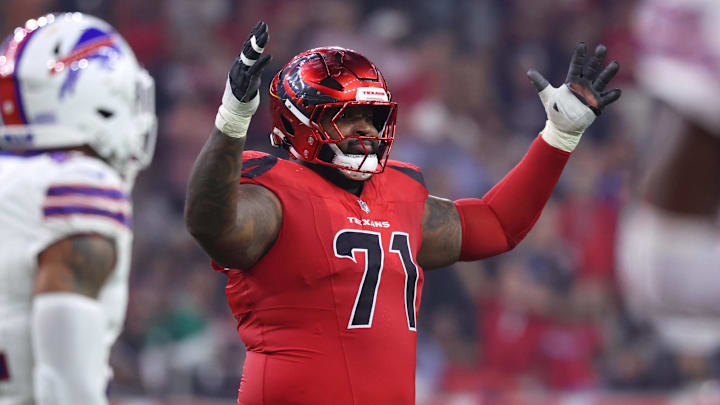 Nov 20, 2025; Houston, Texas, USA; Houston Texans offensive tackle Tytus Howard (71) reacts after a touchdown against the Buffalo Bills in the second quarter at NRG Stadium. Mandatory Credit: Troy Taormina-Imagn Images