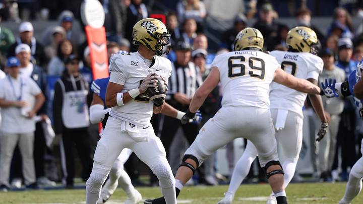 Nov 29, 2025; Provo, Utah, USA; UCF Knights quarterback Tayven Jackson (2) looks to pass against the BYU Cougars during the second quarter at LaVell Edwards Stadium. Mandatory Credit: Rob Gray-Imagn Images Nov 29, 2025; Provo, Utah, USA; UCF Knights quarterback Tayven Jackson (2) looks to pass against the BYU Cougars during the second quarter at LaVell Edwards Stadium. Mandatory Credit: Rob Gray-Imagn Images