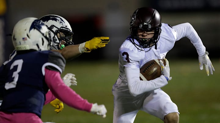 Winneconne High School's Brody Schaffer (3) runs for a first down on a reception against Xavier High School during their football game Friday, October 27, 2023, in Appleton, Wis. Xavier won 14-3. Winneconne High School's Brody Schaffer (3) runs for a first down on a reception against Xavier High School during their football game Friday, October 27, 2023, in Appleton, Wis. Xavier won 14-3.