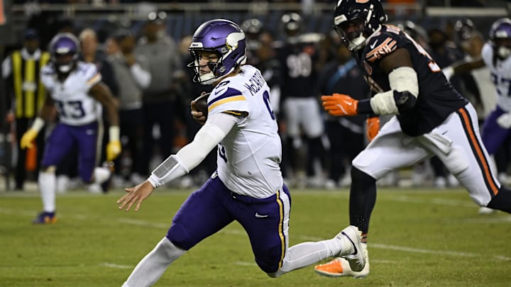 Sep 8, 2025; Chicago, Illinois, USA; Minnesota Vikings quarterback J.J. McCarthy (9) rushes the ball against the Chicago Bears during the first half at Soldier Field.