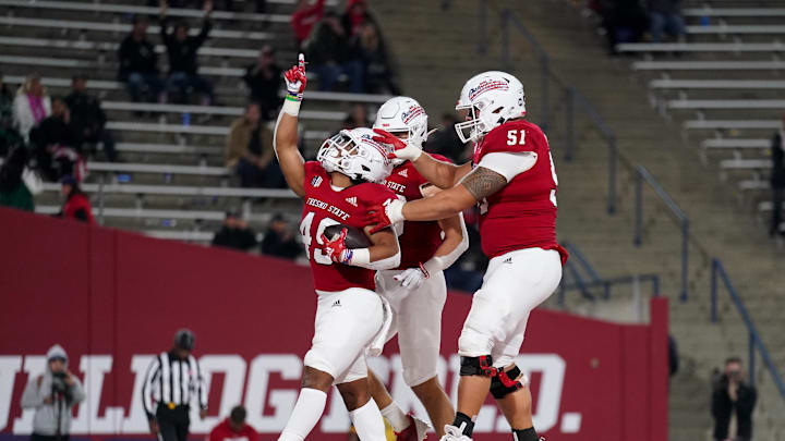 Nov 5, 2022; Fresno, California, USA; Fresno State Bulldogs running back Elijah Gilliam (49) celebrates with offensive lineman Mose Vavao (51) after rushing for a touchdown against the Hawaii Rainbow Warriors in the fourth quarter at Valley Children's Stadium. Mandatory Credit: Cary Edmondson-Imagn Images Nov 5, 2022; Fresno, California, USA; Fresno State Bulldogs running back Elijah Gilliam (49) celebrates with offensive lineman Mose Vavao (51) after rushing for a touchdown against the Hawaii Rainbow Warriors in the fourth quarter at Valley Children's Stadium. Mandatory Credit: Cary Edmondson-Imagn Images