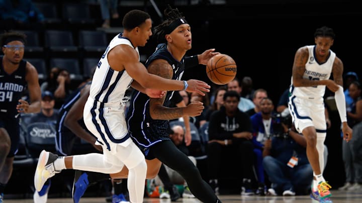 Oct 3, 2022; Memphis, Tennessee, USA; Orlando Magic forward Paolo Banchero (5) steals the ball from Memphis Grizzlies guard Desmond Bane (22) during the first half at FedExForum. Mandatory Credit: Petre Thomas-Imagn Images