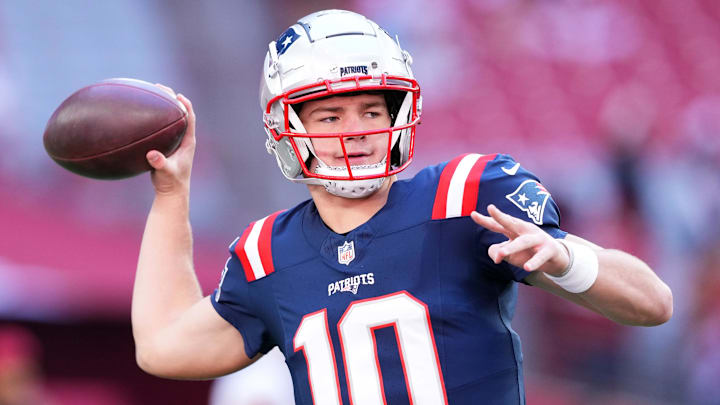 Dec 15, 2024; Glendale, Arizona, USA; New England Patriots quarterback Drake Maye (10) warms up before the game against the New England Patriots at State Farm Stadium. Mandatory Credit: Joe Camporeale-Imagn Images