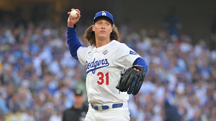 Oct 27, 2025; Los Angeles, California, USA; Los Angeles Dodgers pitcher Tyler Glasnow (31) throws to first for an out against Toronto Blue Jays second baseman Bo Bichette (11) in the second inning during game three of the 2025 MLB World Series at Dodger Stadium. Mandatory Credit: Jayne Kamin-Oncea-Imagn Images