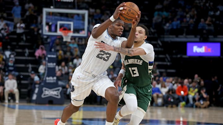 Dec 26, 2025; Memphis, Tennessee, USA; Memphis Grizzlies forward Cedric Coward (23) drives to the basket as Milwaukee Bucks guard Ryan Rollins (13) defends during the fourth quarter at FedExForum. Mandatory Credit: Petre Thomas-Imagn Images Dec 26, 2025; Memphis, Tennessee, USA; Memphis Grizzlies forward Cedric Coward (23) drives to the basket as Milwaukee Bucks guard Ryan Rollins (13) defends during the fourth quarter at FedExForum. Mandatory Credit: Petre Thomas-Imagn Images