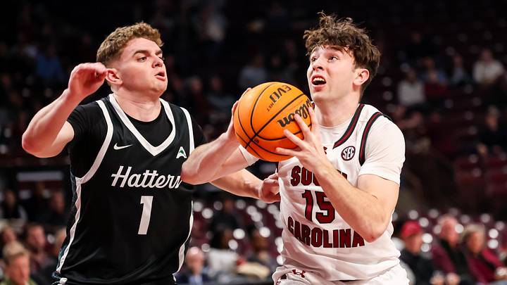 Dec 6, 2025; Columbia, S.C.; South Carolina guard Eli Ellis (15) drives around Stetson guard Ethan Copeland (1).