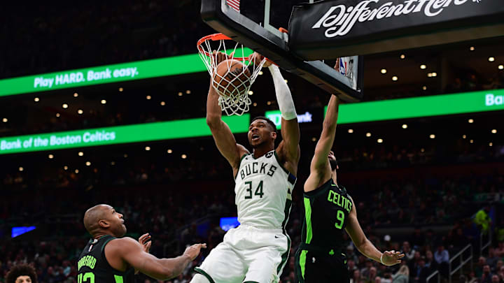 Dec 6, 2024; Boston, Massachusetts, USA; Milwaukee Bucks forward Giannis Antetokounmpo (34) dunks the ball past Boston Celtics guard Derrick White (9) during the first half at TD Garden. Mandatory Credit: Bob DeChiara-Imagn Images Dec 6, 2024; Boston, Massachusetts, USA; Milwaukee Bucks forward Giannis Antetokounmpo (34) dunks the ball past Boston Celtics guard Derrick White (9) during the first half at TD Garden. Mandatory Credit: Bob DeChiara-Imagn Images