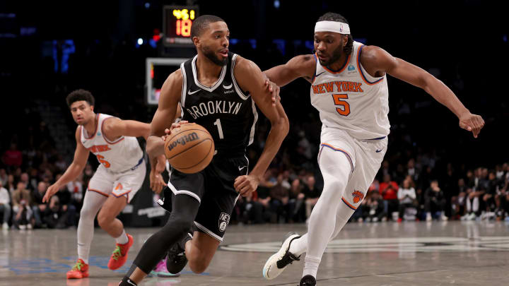 Jan 23, 2024; Brooklyn, New York, USA; Brooklyn Nets forward Mikal Bridges (1) drives to the basket against New York Knicks forward Precious Achiuwa (5) and guard Quentin Grimes (6) during the fourth quarter at Barclays Center. Mandatory Credit: Brad Penner-USA TODAY Sports Jan 23, 2024; Brooklyn, New York, USA; Brooklyn Nets forward Mikal Bridges (1) drives to the basket against New York Knicks forward Precious Achiuwa (5) and guard Quentin Grimes (6) during the fourth quarter at Barclays Center. Mandatory Credit: Brad Penner-USA TODAY Sports