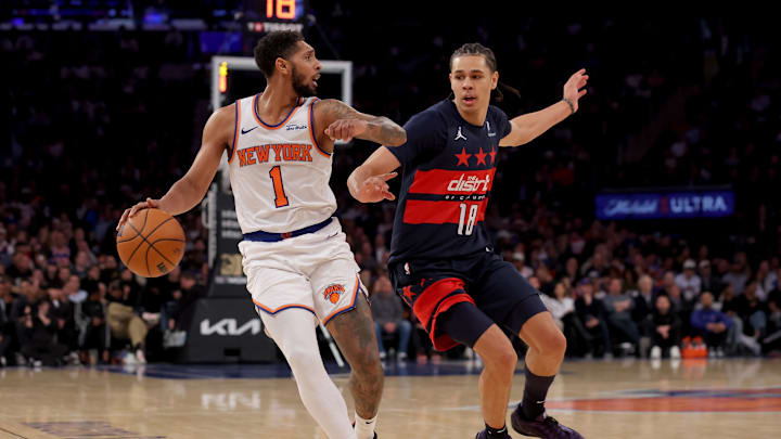 Nov 18, 2024; New York, New York, USA; New York Knicks guard Cameron Payne (1) controls the ball against Washington Wizards forward Kyshawn George (18) during the fourth quarter at Madison Square Garden. Mandatory Credit: Brad Penner-Imagn Images