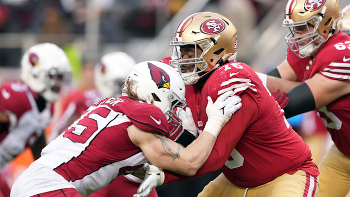 Jan 8, 2023; Santa Clara, California, USA; San Francisco 49ers guard Jaylon Moore (76) blocks Arizona Cardinals linebacker Dennis Gardeck (45) during the fourth quarter at Levi's Stadium. Mandatory Credit: Darren Yamashita-Imagn Images
