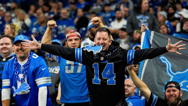 Detroit Lions fans cheer on against Indianapolis Colts. Detroit Lions fans cheer on against Indianapolis Colts.