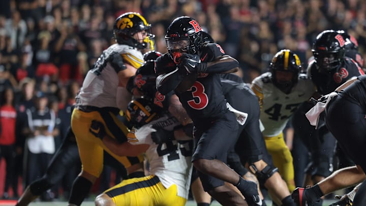 Sep 19, 2025; Piscataway, New Jersey, USA; Rutgers Scarlet Knights running back Antwan Raymond (3) scores a rushing touchdown during the second half against the Iowa Hawkeyes at SHI Stadium. Mandatory Credit: Vincent Carchietta-Imagn Images