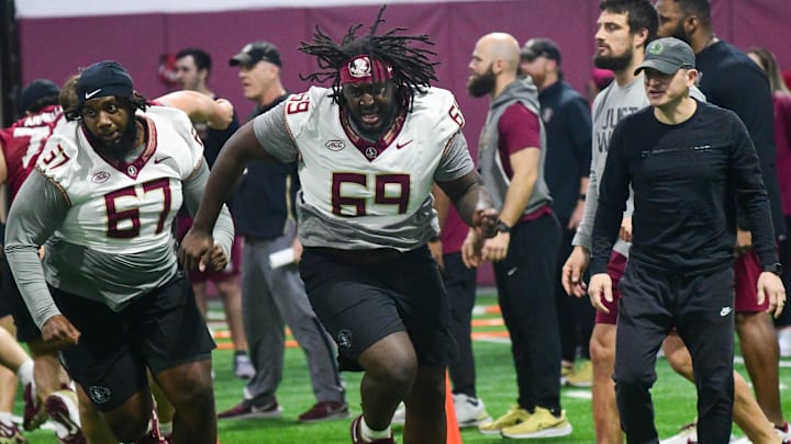 Florida State football players Richie Leonard IV (67) and TJ Ferguson take part in the final Tour of Duty winter workouts ahead of 2024 spring practices on Thursday, March 7, 2024.