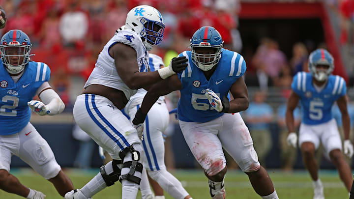 Sep 28, 2024; Oxford, Mississippi, USA; Mississippi Rebels defensive linemen Zxavian Harris (51) rushes as Kentucky Wildcats offensive lineman Jalen Farmer (52) blocks during the first half at Vaught-Hemingway Stadium. Mandatory Credit: Petre Thomas-Imagn Images