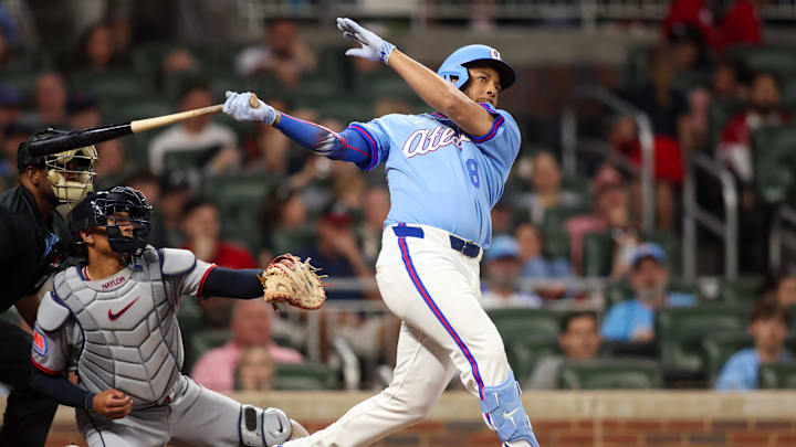 Apr 10, 2026; Atlanta, Georgia, USA; Atlanta Braves designated hitter Dominic Smith (8) hits an RBI single against the Cleveland Guardians in the sixth inning at Truist Park. Mandatory Credit: Brett Davis-Imagn Images
