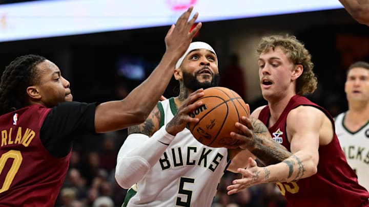 Nov 4, 2024; Cleveland, Ohio, USA; Milwaukee Bucks guard Gary Trent Jr. (5) drives to the basket between Cleveland Cavaliers guard Darius Garland (10) and guard Luke Travers (33) during the first half at Rocket Mortgage FieldHouse. Mandatory Credit: Ken Blaze-Imagn Images Nov 4, 2024; Cleveland, Ohio, USA; Milwaukee Bucks guard Gary Trent Jr. (5) drives to the basket between Cleveland Cavaliers guard Darius Garland (10) and guard Luke Travers (33) during the first half at Rocket Mortgage FieldHouse. Mandatory Credit: Ken Blaze-Imagn Images