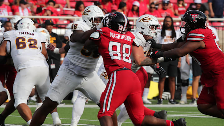 Sep 21, 2024; Lubbock, Texas, USA;  Arizona State Sun Devils offensive tackle Max Iheanachor (58) blocks Texas Tech Red Raiders defensive back Amier Washington (88) in the second half at Jones AT&T Stadium and Cody Campbell Field. Mandatory Credit: Michael C. Johnson-Imagn Images
