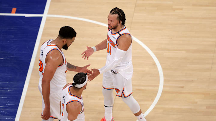 May 29, 2025; New York, New York, USA; New York Knicks guard Jalen Brunson (11) and center Karl-Anthony Towns (32) and guard Josh Hart (3) react in the fourth quarter against the Indiana Pacers during game five of the eastern conference finals for the 2025 NBA Playoffs at Madison Square Garden. Mandatory Credit: Brad Penner-Imagn Images