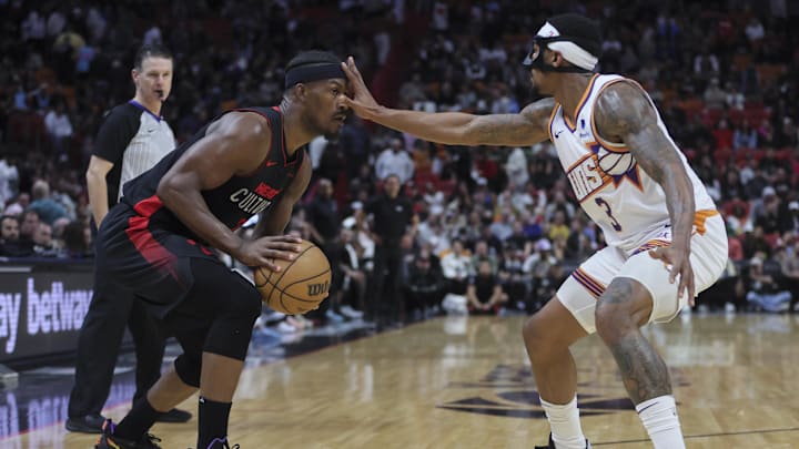 Miami Heat forward Jimmy Butler (22) is guarded by Phoenix Suns guard Bradley Beal (3) during the fourth quarter at Kaseya Center.