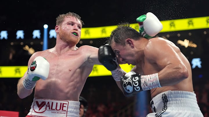 Canelo Alvarez (red trunks) and Gennadiy Golovkin (white trunks) box during a super middleweight championship bout at T-Mobile Arena. 