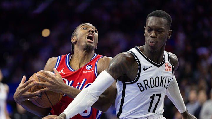Nov 22, 2024; Philadelphia, Pennsylvania, USA; Philadelphia 76ers guard Tyrese Maxey (0) drives against Brooklyn Nets guard Dennis Schroder (17) during the fourth quarter at Wells Fargo Center. Mandatory Credit: Bill Streicher-Imagn Images