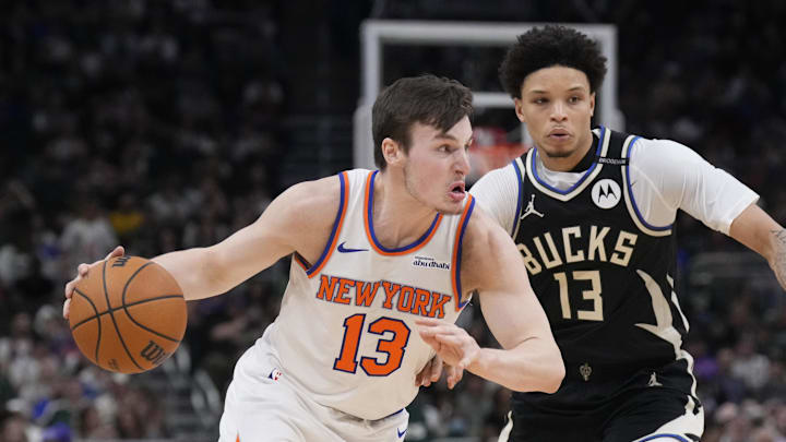 New York Knicks guard Tyler Kolek drives to the basket against Milwaukee Bucks guard Ryan Rollins in the second half at Fiserv Forum. Mandatory Credit: Michael McLoone-Imagn Images