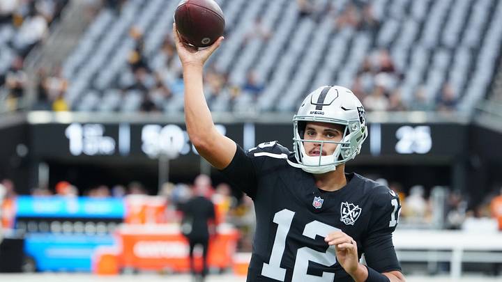 Oct 13, 2024; Paradise, Nevada, USA; Las Vegas Raiders quarterback Aidan O'Connell (12) warms up before a game against the Las Vegas Raiders at Allegiant Stadium. Mandatory Credit: Stephen R. Sylvanie-Imagn Images