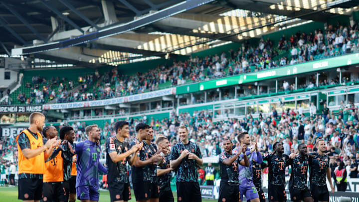 Bayern Munich players acknowledge the traveling away fans after the win at Werder Bremen 
