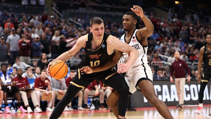 Mar 16, 2023; Orlando, FL, USA; College of Charleston Cougars forward Ante Brzovic (10) goes to the basket while defended by San Diego State Aztecs guard Lamont Butler (5) during the second half at Amway Center. Mandatory Credit: Matt Pendleton-Imagn Images Mar 16, 2023; Orlando, FL, USA; College of Charleston Cougars forward Ante Brzovic (10) goes to the basket while defended by San Diego State Aztecs guard Lamont Butler (5) during the second half at Amway Center. Mandatory Credit: Matt Pendleton-Imagn Images