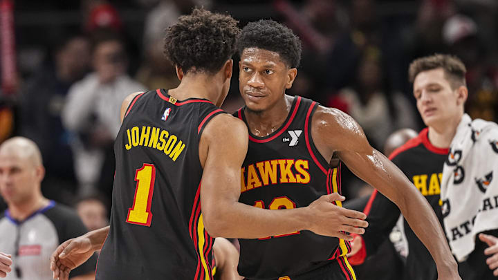 Dec 28, 2024; Atlanta, Georgia, USA; Atlanta Hawks forward Jalen Johnson (1) reacts with forward De'Andre Hunter (12) after the Hawks defeated the Miami Heat at State Farm Arena. Mandatory Credit: Dale Zanine-Imagn Images Dec 28, 2024; Atlanta, Georgia, USA; Atlanta Hawks forward Jalen Johnson (1) reacts with forward De'Andre Hunter (12) after the Hawks defeated the Miami Heat at State Farm Arena. Mandatory Credit: Dale Zanine-Imagn Images