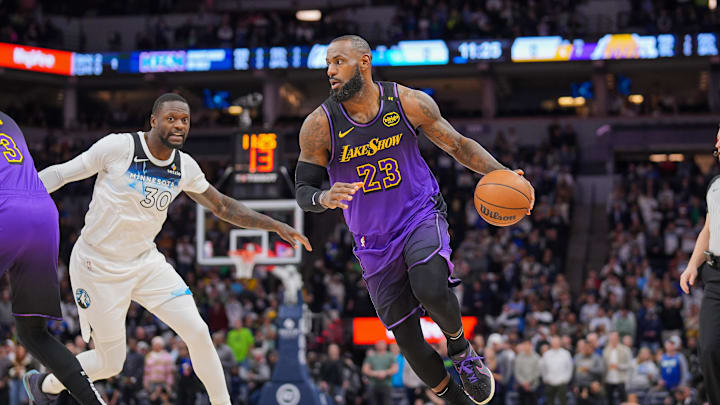 Dec 2, 2024; Minneapolis, Minnesota, USA; Los Angeles Lakers forward LeBron James (23) dribbles against the Minnesota Timberwolves in the first quarter at Target Center. Mandatory Credit: Brad Rempel-Imagn Images