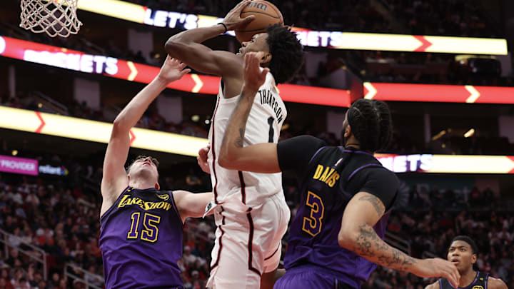 Jan 5, 2025; Houston, Texas, USA; Houston Rockets forward Amen Thompson (1) grabs an offensive rebound against Los Angeles Lakers guard Austin Reaves (15) in the second quarter at Toyota Center. Mandatory Credit: Thomas Shea-Imagn Images Jan 5, 2025; Houston, Texas, USA; Houston Rockets forward Amen Thompson (1) grabs an offensive rebound against Los Angeles Lakers guard Austin Reaves (15) in the second quarter at Toyota Center. Mandatory Credit: Thomas Shea-Imagn Images
