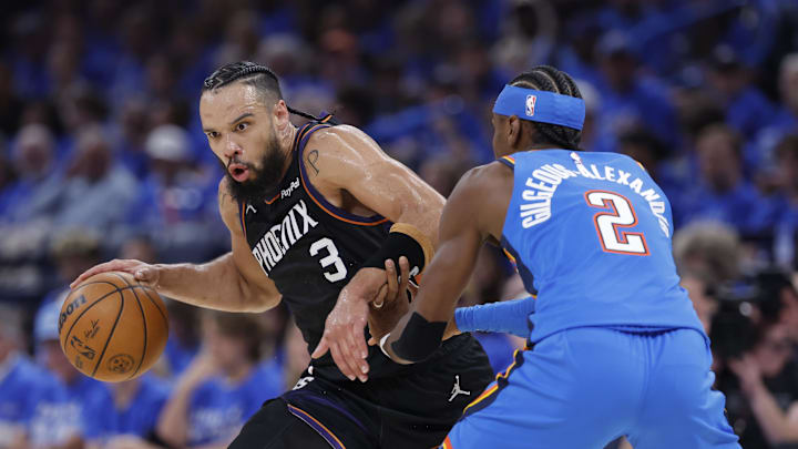 Apr 19, 2026; Oklahoma City, Oklahoma, USA; Phoenix Suns forward Dillon Brooks (3) drives around Oklahoma City Thunder guard Shai Gilgeous-Alexander (2) in the second quarter during game one of the first round of the 2026 NBA Playoffs at Paycom Center. Mandatory Credit: Alonzo Adams-Imagn Images