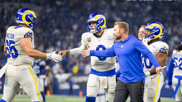 Oct 1, 2023; Indianapolis, Indiana, USA; Los Angeles Rams quarterback Matthew Stafford (9) celebrates his game winning pass with teammates and head coach Sean McVay in the overtime against the Indianapolis Colts at Lucas Oil Stadium. Mandatory Credit: Trevor Ruszkowski-Imagn Images