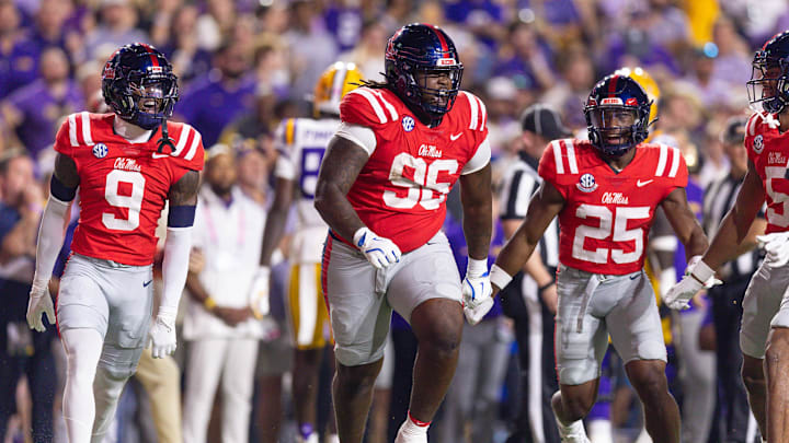 Oct 12, 2024; Baton Rouge, Louisiana, USA;  Mississippi Rebels defensive tackle Jamarious Brown (96) reacts after intercepting a pass against the LSU Tigers during the first half at Tiger Stadium. Mandatory Credit: Stephen Lew-Imagn Images