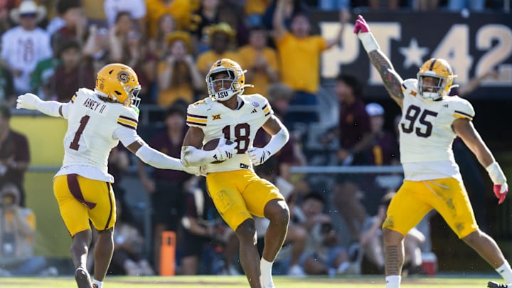 Oct 18, 2025; Tempe, Arizona, USA; Arizona State Sun Devils linebacker Martell Hughes (18) celebrates an interception with teammates Keith Abney II (1) and Justin Wodtly (95) against the Texas Tech Red Raiders in the second half at Mountain America Stadium. Mandatory Credit: Mark J. Rebilas-Imagn Images Oct 18, 2025; Tempe, Arizona, USA; Arizona State Sun Devils linebacker Martell Hughes (18) celebrates an interception with teammates Keith Abney II (1) and Justin Wodtly (95) against the Texas Tech Red Raiders in the second half at Mountain America Stadium. Mandatory Credit: Mark J. Rebilas-Imagn Images
