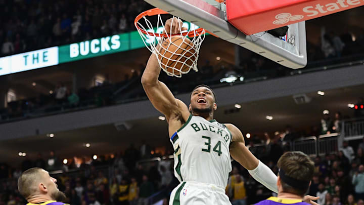 Mar 13, 2025; Milwaukee, Wisconsin, USA;  Milwaukee Bucks forward Giannis Antetokounmpo (34) dunks against the Los Angeles Lakers in the first quarter at Fiserv Forum. Mandatory Credit: Benny Sieu-Imagn Images