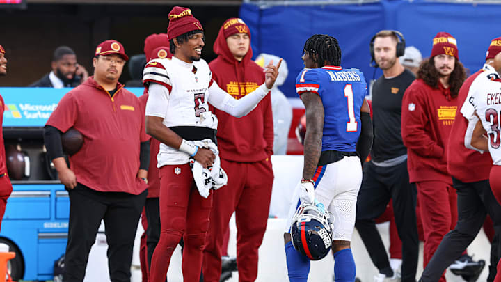 Nov 3, 2024; East Rutherford, New Jersey, USA; New York Giants wide receiver Malik Nabers (1) talks with Washington Commanders quarterback Jayden Daniels (5) during a time out during the second half at MetLife Stadium. Mandatory Credit: Vincent Carchietta-Imagn Images